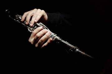 clarinet in hand in the dark