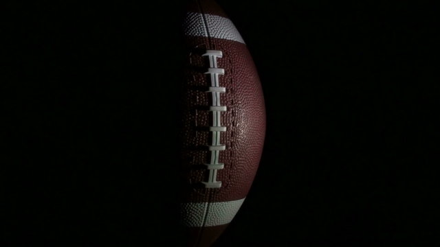 Football rotates against black full - HD