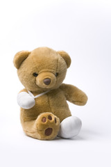 Wounded toy bear with bandages