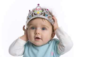 Portrait of a baby girl with a toy crown