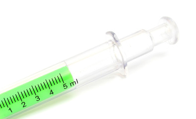 Syringe with green liquid