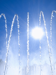 Fountain jets against sunlight