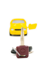 Car keys and car at background isolated on white
