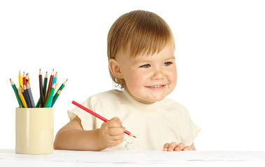 Child draw with red crayon