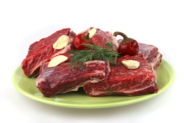 uncooked ribs on dish