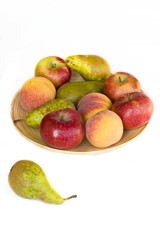 Bowl with fruits on a white background