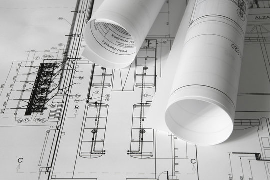 Rolled plans on the table