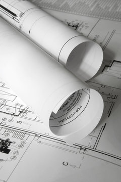 Rolled plans on the table