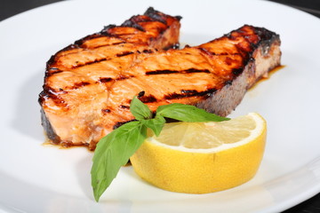Grilled salmon on the white plate