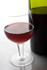 red wine glass and bottle