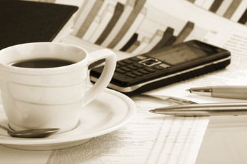 Cup  coffee on a morning paper business news
