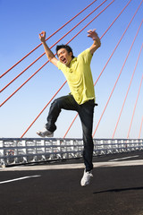 Young man jump with wierd expression