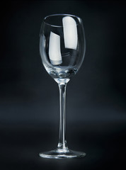 Empty wineglass on black background