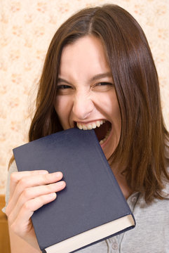 Young attractive woman with book