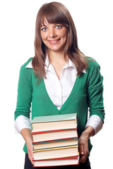 Smiling young pretty woman with pile of books