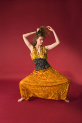 Attractive girl in yellow dress in meditation