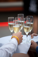 A Person takes a glass of champagne