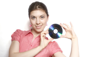 Portrait of the girl with a compact disk in hands.
