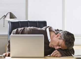 Attractive man plugging in USB cord