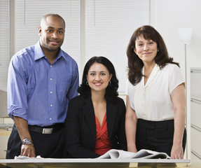Business team posing for picture.