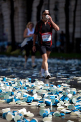 paper cups on street at marathon