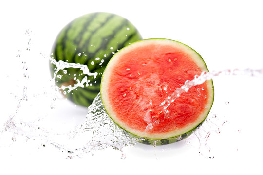 water splashing on watermelon half