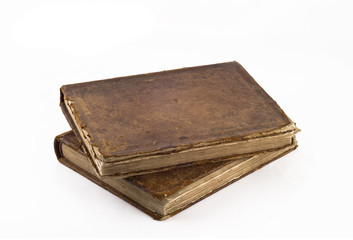 Stack of Old frayed books isolated over white