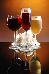 Two of each red, rose and white wine with roses