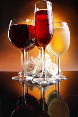 Two of each red, rose and white wine with roses