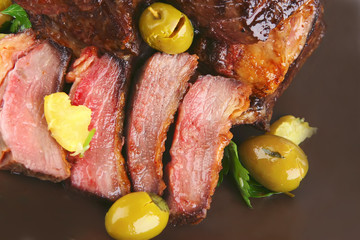 rib's and olive on dish