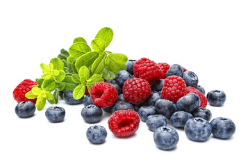 berries: raspberries and bilberries on white background