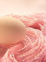 Egg on a pink fabric