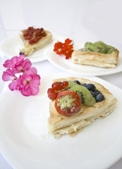 three slices of cake with flowers
