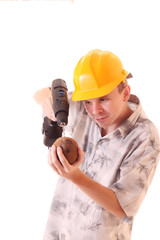 man with drill and coconut