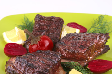 ribs on green dish