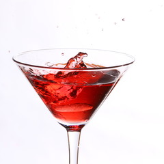red cocktail on white
