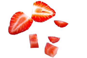 group of isloated strawberries cut in different ways