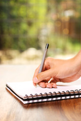 Hand writing on notepad