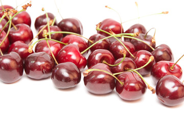 group of red cherries isolated on white