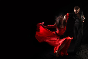 dancer in action against black background - obrazy, fototapety, plakaty