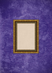 Grunge purple stucco wall with empty picture frame