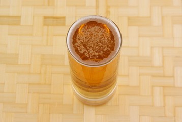 Glass of fresh golden beer