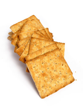 Stack of crackers on white background
