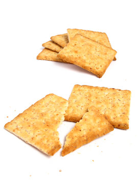 Stack of crackers on white background