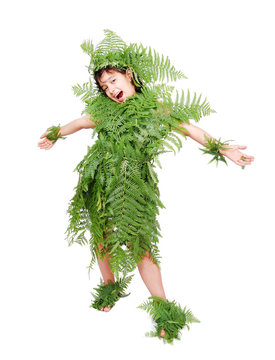 Pretty little girl dressed in green plant leafs