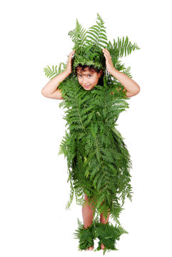 Pretty little girl dressed in green plant leafs