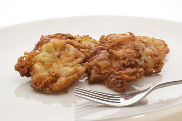 breaded zucchini on a white plate