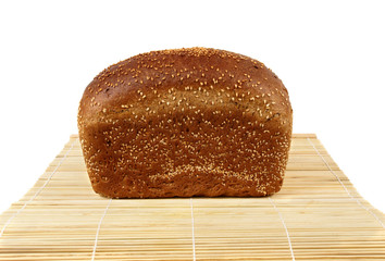 A loaf of rye bread with sesame