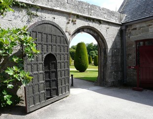 Old Wooden Arched Gateway And Door