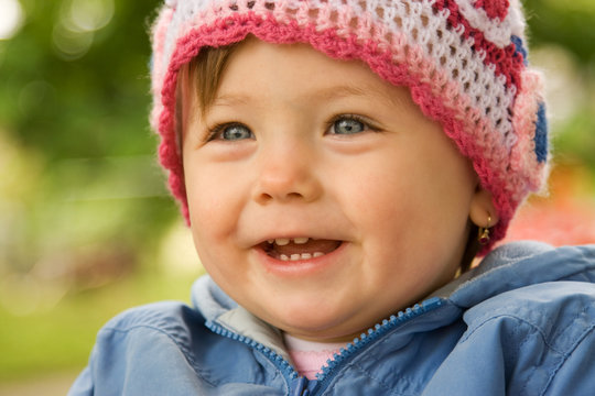 Smiling baby wearing hat